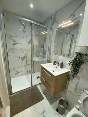 a bathroom with a shower and a sink and a toilet at mure in Beaulieu-sur-Mer