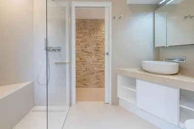 a bathroom with a glass shower and a sink at Ferreira in Saint-Jean-Cap-Ferrat