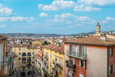 a view of a city with buildings and a clock tower at Casa Nissa Vieux-Nice in Nice