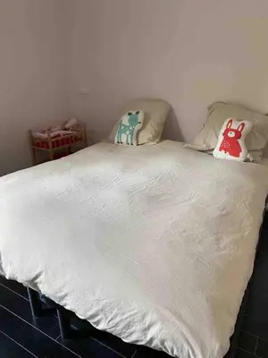a white bed with two pillows on top of it at Luxury villa with Pool and Garden perfect location in Beaulieu-sur-Mer