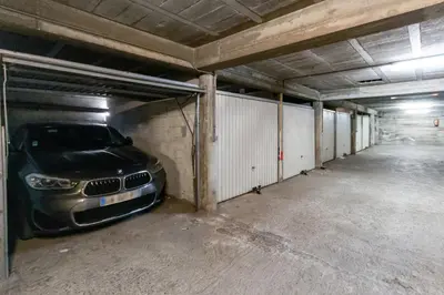 a car is parked in a parking garage at Le Galion - City centre - Bright - AC - Parking in Cagnes-sur-Mer