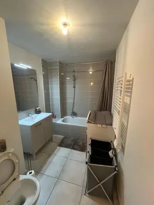 a bathroom with a tub and a sink and a toilet at Le Riviera in Nice
