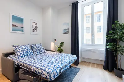 a bedroom with a bed and a window at 1 CASSINI LOT 5 - Magnifique Studio - Garibaldi - Port in Nice