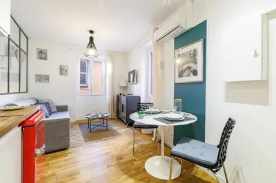 a living room with a couch and a table at 1 GALLO LOT 3 - Joli appartement au coeur du Vieux-Nice - AC in Nice