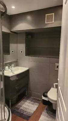 a bathroom with a sink and a toilet at Nice 2-room apartment off the beach in Nice