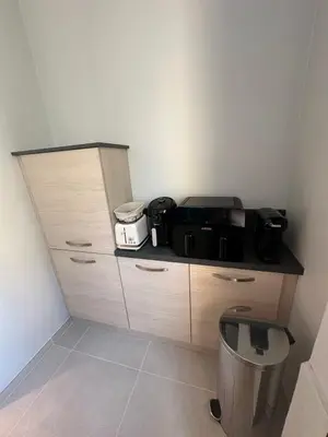 a kitchen with a counter top with appliances on it at Spacious apartment in Nice with balcony in Nice