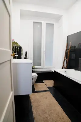 a bathroom with a tub and a toilet and a sink at Fantastic Centra Peaceful Location in Nice