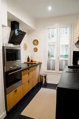 a kitchen with a stove and a microwave at Fantastic Centra Peaceful Location in Nice