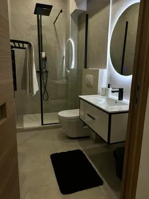 a bathroom with a toilet and a sink and a shower at Luxueux Logement à 2 pas de la mer, Vieille ville in Nice