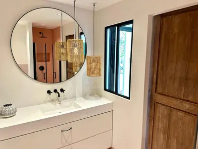 a bathroom with a sink and a mirror at L'âme de Nice - Terrasse dorée sur Place Masséna in Nice