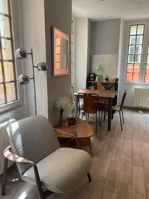 a living room with tables and chairs and a chair at Authentic Nice Old Town, separate bedroom, AC in Nice