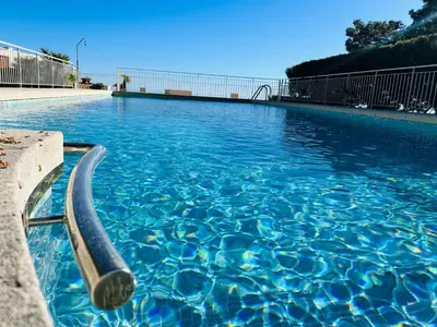 a swimming pool with a hose in the water at - Casa ATI - in Villefranche-sur-Mer