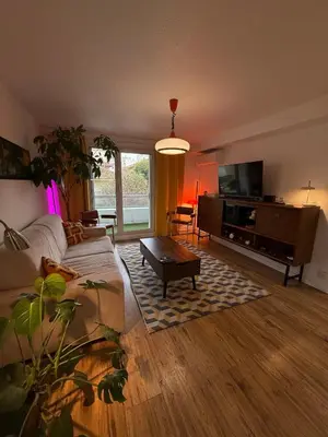 a living room with a couch and a tv at AZUR DELUXE Nice in Nice