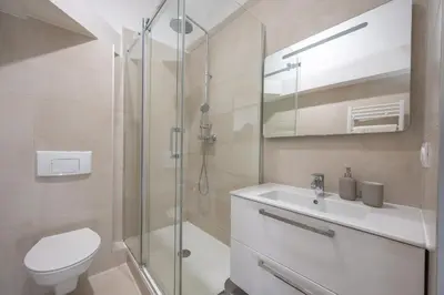 a bathroom with a shower and a toilet and a sink at Quartier Libération - La Vie à la Niçoise in Nice