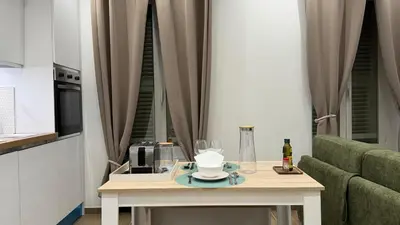 a table with a coffee maker and glasses on it at New T2 Nice Jean Médecin - L'Hacienda de Bali in Nice