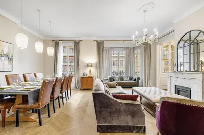 a living room with a table and chairs and a fireplace at Nice Renting - AMOUR - Haussmann Luxury Sea Balcony Free Parking in Nice