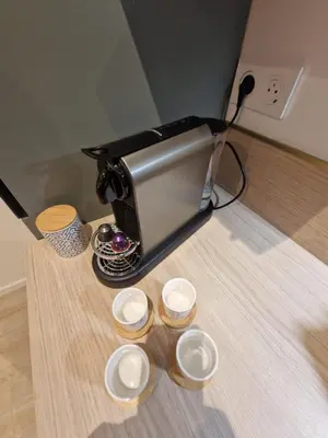a toaster sitting on a table with three bowls at Alex&Chris in Nice