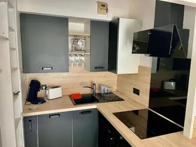a kitchen with a sink and a counter top at Le riviera bay avec parking in Saint-Laurent-du-Var