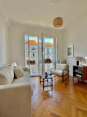 a living room with a couch and a table at Un cocon en centre ville de Nice 2 personnes in Nice