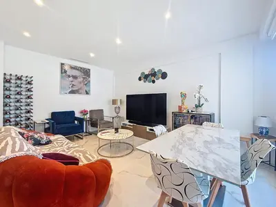 a living room with a couch and a table at Nestor&Jeeves - TERRASSE D OR - By sea - Terrace in Nice