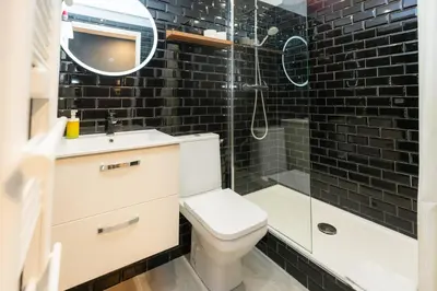 a bathroom with a toilet and a glass shower at Victoria 2 People Parking AC WiFi in Nice