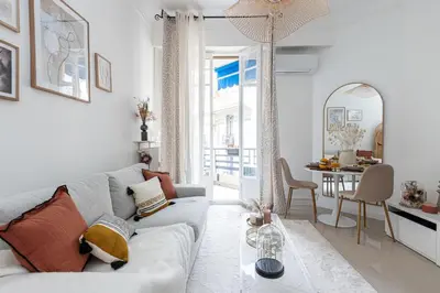 a living room with a couch and a table at MY CASA - VERDI - Superb Studio Suite City Center in Nice