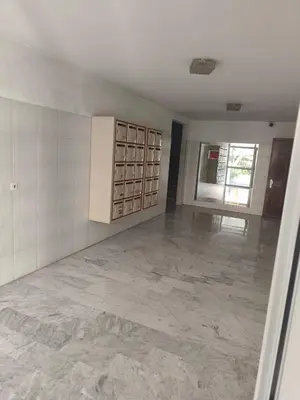 a large empty room with a large tile floor at Bel appartement in Nice