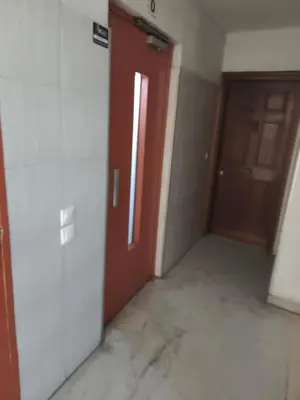 an empty room with a door and a hallway at Bel appartement in Nice