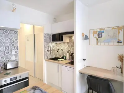 a small kitchen with a sink and a counter at Cœur Libération Nice Studio in Nice