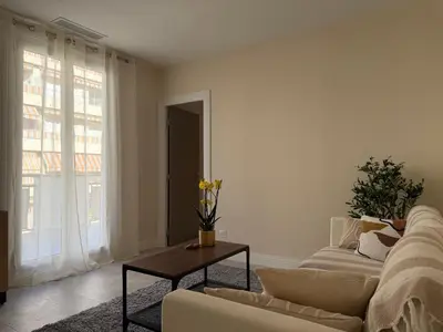 a living room with a couch and a table at Oscar II in Nice