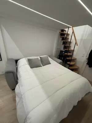 a large bed in a room with a wooden floor at Studio Rio - Jean Médecin - La Riviera LCD in Nice