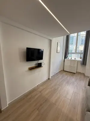 a living room with a couch and paintings on the wall at Studio Rio - Jean Médecin - La Riviera LCD in Nice