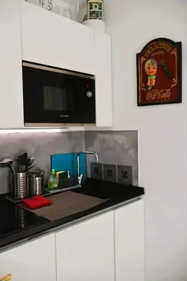 a kitchen counter with a sink and a microwave at T2 Cozy & Air-conditioned, close to All Amenities in Nice