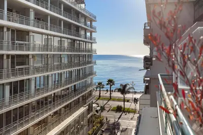 a view of the ocean from a building at Suite Lycka FSHH in Nice
