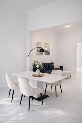 a white table and chairs in a living room at Blanche - From Nice with love in Nice