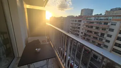 a balcony of a building with a table on it at Cosy 1 Bedroom, balcony, Promenade des Anglais in Nice