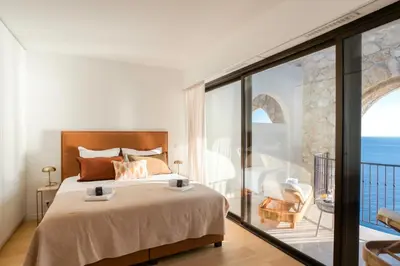 a bedroom with a bed and a view of the ocean at Satywizus #22- Duplex panoramic sea view 2Bdr, AC, swimpool, parking, petanque in Nice