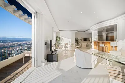 an open kitchen and living room with a view of the city at Vue exceptionnelle in Nice