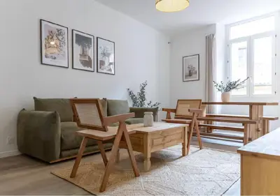 a living room with a couch and chairs and a table at Élégance & confort au cœur du Vieux Nice in Nice