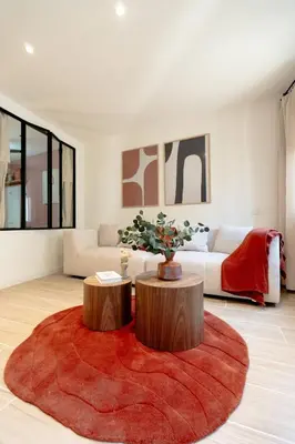 a living room with two tables and a couch at Splendide Appartement Rénové Au Cœur du Vieux Nice in Nice