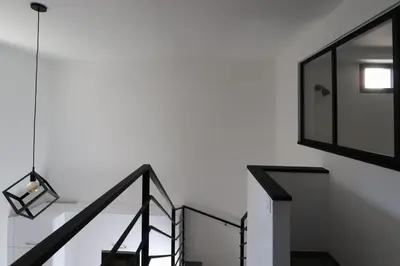 a black and white staircase with a glass wall at Nümad Suites in Nice