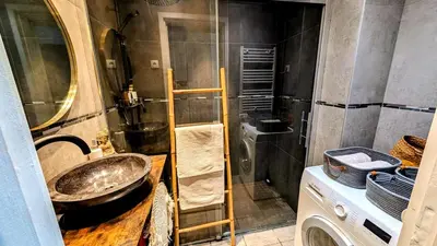 a bathroom with a sink and a shower at PANORAMIC SEA VIEW with PRIVATE PARKING and AC in Nice