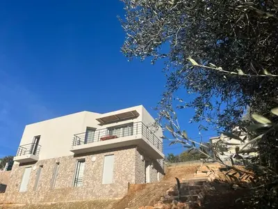 a building with a balcony on top of it at La costière in Nice