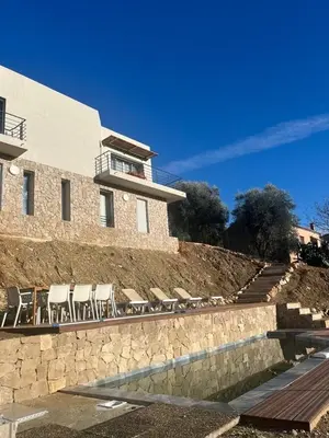 a group of chairs sitting next to a building at La costière in Nice