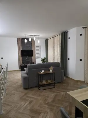 a living room with a couch and a table at La costière in Nice