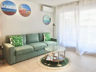 a green towel sitting on a bathroom sink at Nice Time - Chic Apartment with sunny terrace, Nice Port in Nice