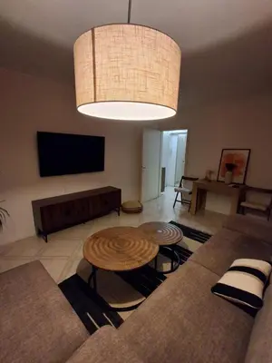 a living room with a couch and a table at Appartement 4 couchages Nice in Nice