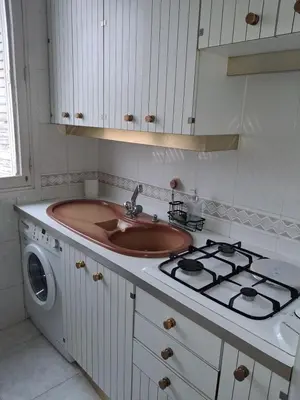 a kitchen with a sink and a stove at Appartement 4 couchages Nice in Nice