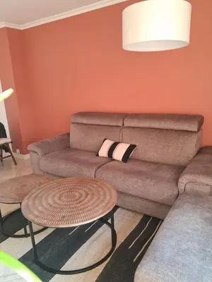 a living room with a couch and a table at Appartement 4 couchages Nice in Nice