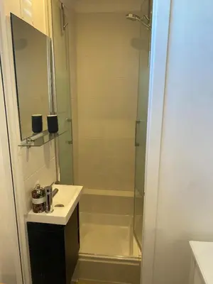 a bathroom with a shower and a sink and a mirror at Studio Nice cosy et plein centre in Nice